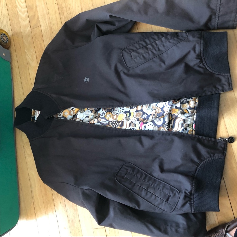 Slightly faded black comber jacket.